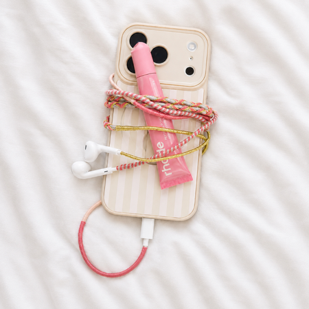 Posh Tech Wrapped Wired In-Ear Headphones with hand-wrapped braided cable in Coral.