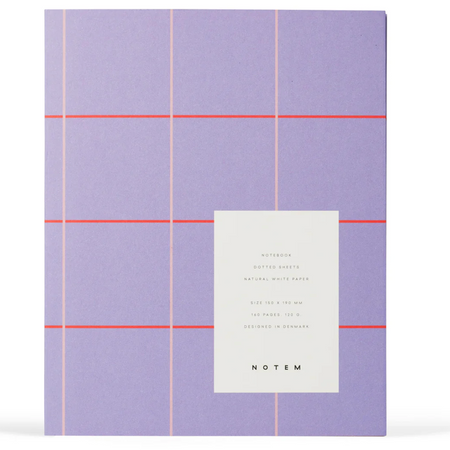 A Notem notebook with a lavender cover featuring a minimalist grid pattern in light pink and thin coral-red horizontal lines, with a white paper label on the front displaying product details.