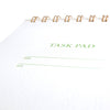 Task pad with 'TASK PAD' text on a white background
