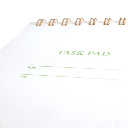 Task pad with 'TASK PAD' text on a white background