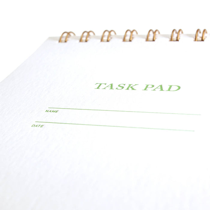 Task pad with 'TASK PAD' text on a white background